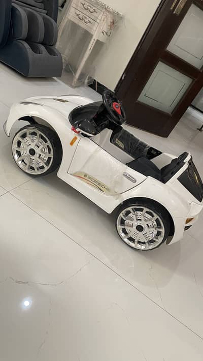 Electric rechargeable baby car with remote control and charger