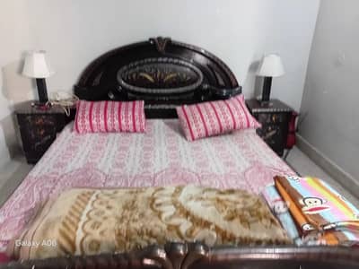 Double bed with side tables in good condition