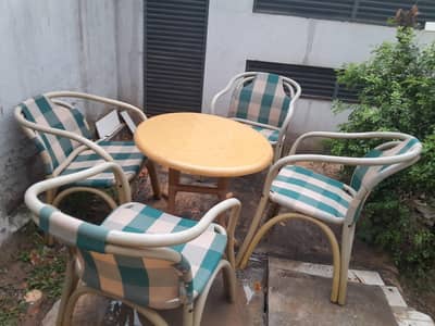 A set of 4 garden chairs and a table. For sale.