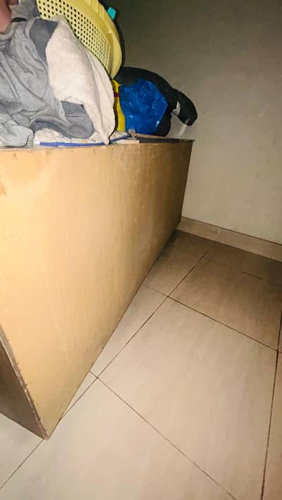 Wooden counter for anything with daraz and shelves and cabinet