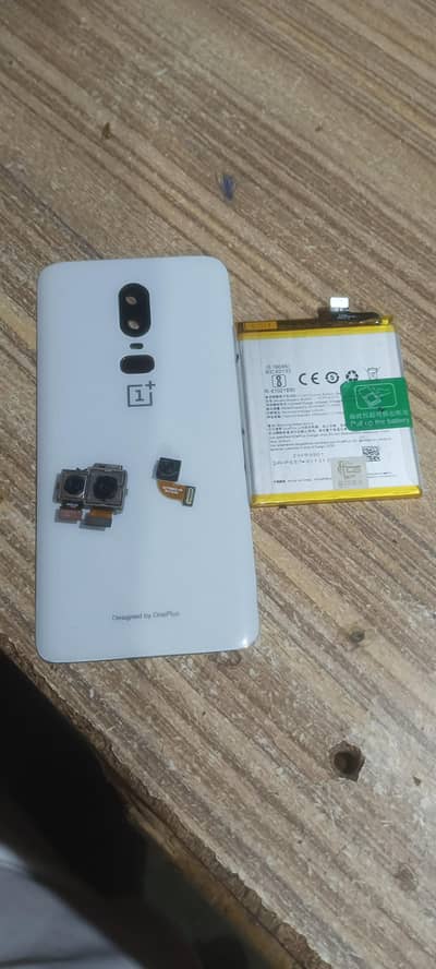 oone plus 6 back with fingers parint camry battery