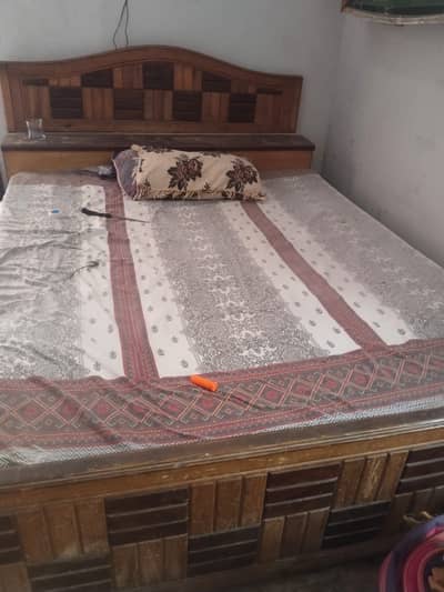 Old bed with mattress