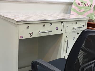 Study table with medium size revolving chair