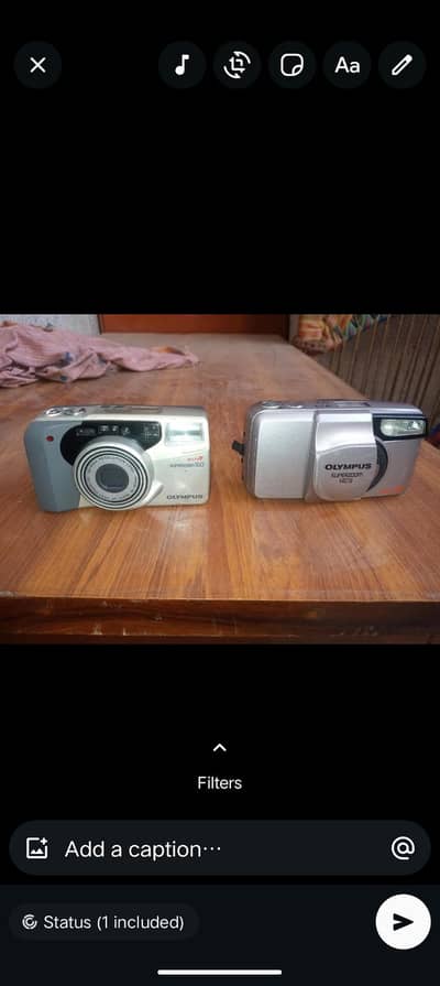 x2 Olympus reel camera for urgent sale