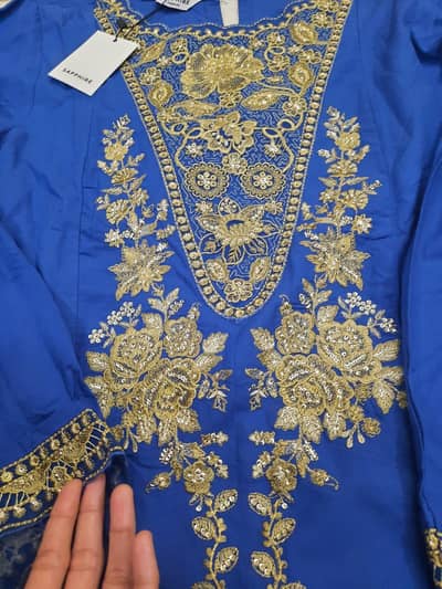 2 new tagged dresses one of gul ahmed and one of sapphire