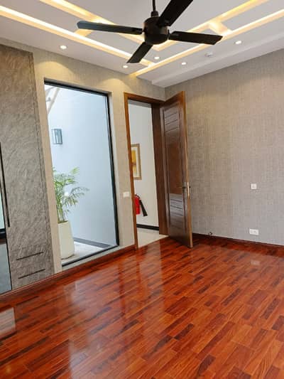 Own a 10-Marla Modern Luxury Bungalow in DHA Lahore Phase 7 Block Y 4-Master Bedrooms, 2 Stylish Kitchens, Spacious Drawing & Dining, Terrace & Independent Access Prime Location with Easy Deal by Buttar Estate & Groups