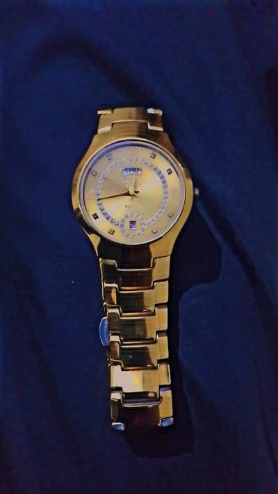 golden colour cermina watch