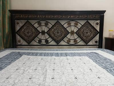 rod iron bed and a dressing