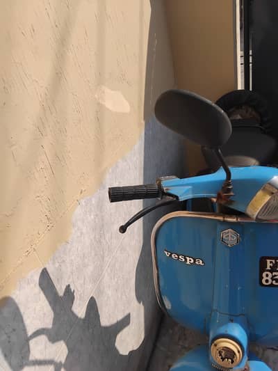 Vespa in blue colour