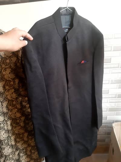 black sherwani gracefully