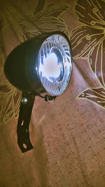 sports cycle head light fits on front mud guards and cells are gift