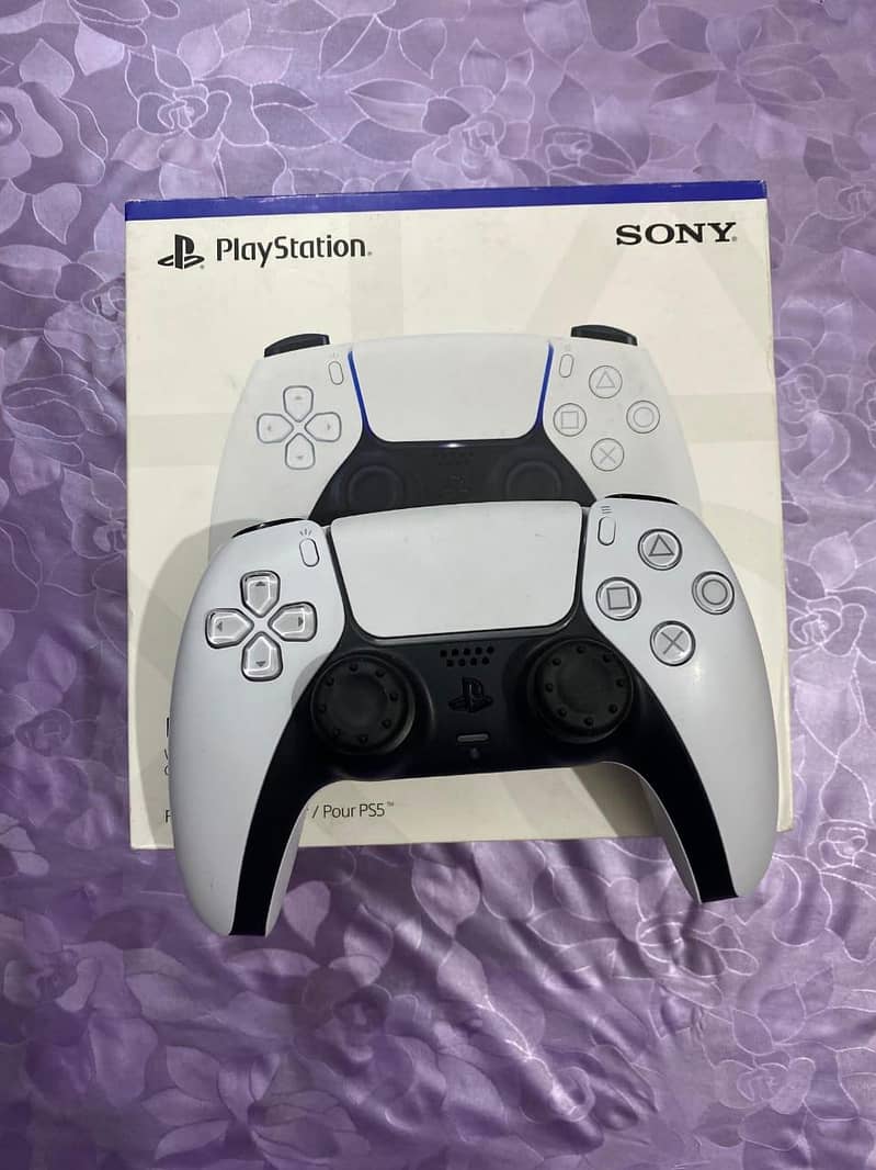 ps5 used with extra wireless controller. . controller charging station 3