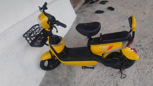 Yellow Electric Scooter with Basket