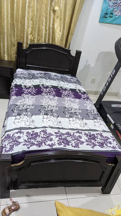 2 single bed with one side table. .