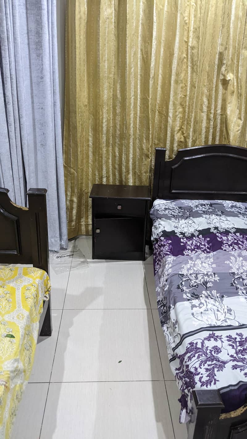 2 single bed with one side table. . 1