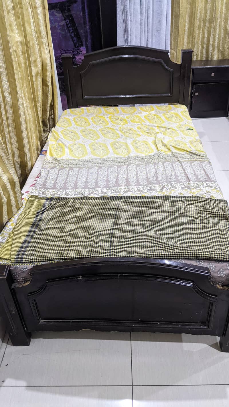 2 single bed with one side table. . 2