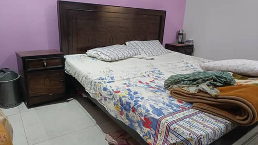 double bed with side table