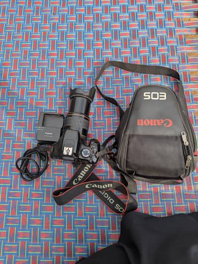 DSLR camera for sale only 30,000  With 200mm  lans condition 10/10