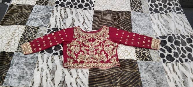 Stunning Deep Red Organza Bridal Lehnga – Heavy Copper Work