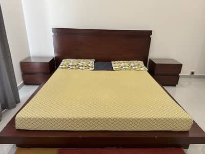 Double bed with side tables and without mattress