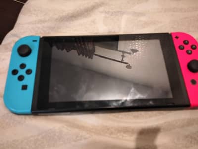 Nintendo switch 1 for urgent sale , with 5 paid games downloaded