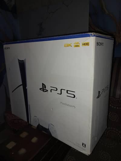 playstation 5 slim disc with box and two controller