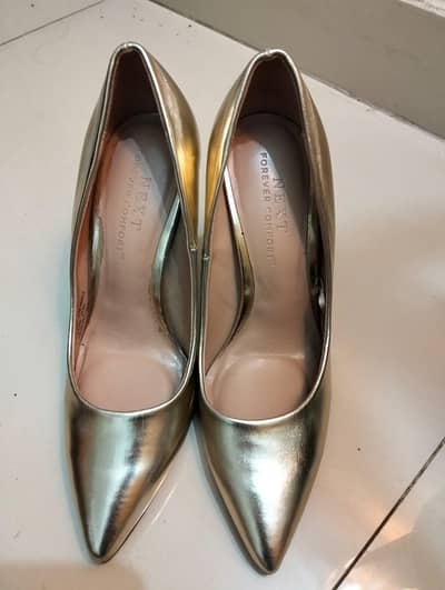 Gold Stilleto heels