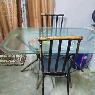 Glass top dinning table with chairs