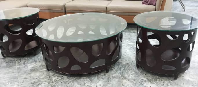 three set of nesting table set with glass top