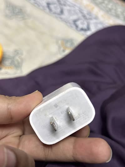 Apple made geniune charger came from UK