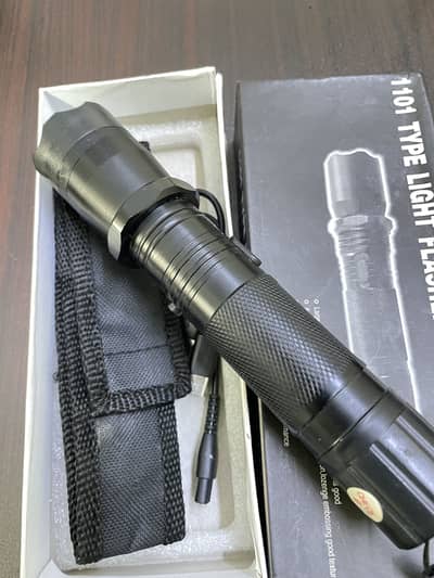Flashlight with self stun gun