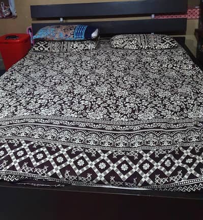 wooden bed and mattress