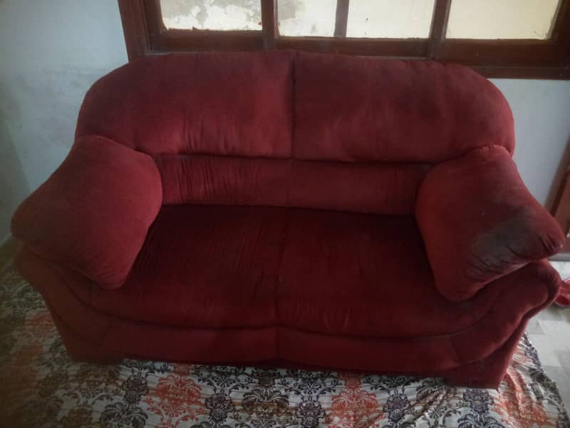 a maroon sofa 0