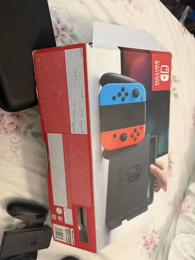 Nintendo switch 1 with two additional controllers
