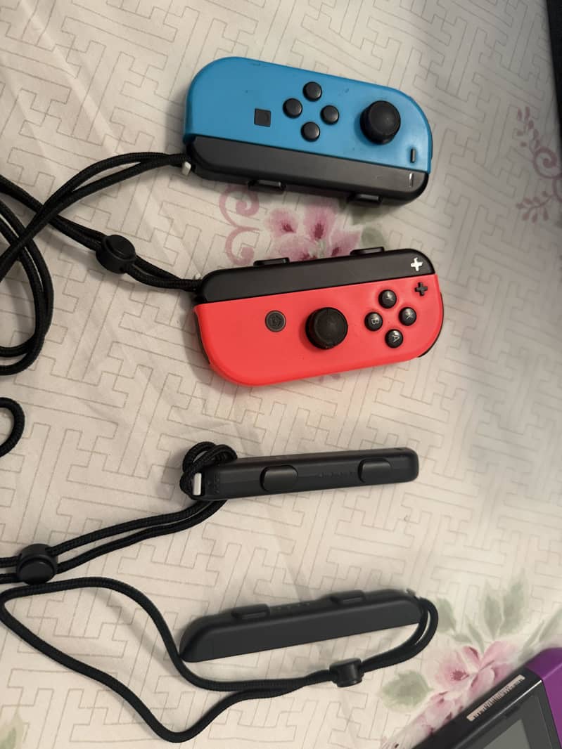 Nintendo switch 1 with two additional controllers 1