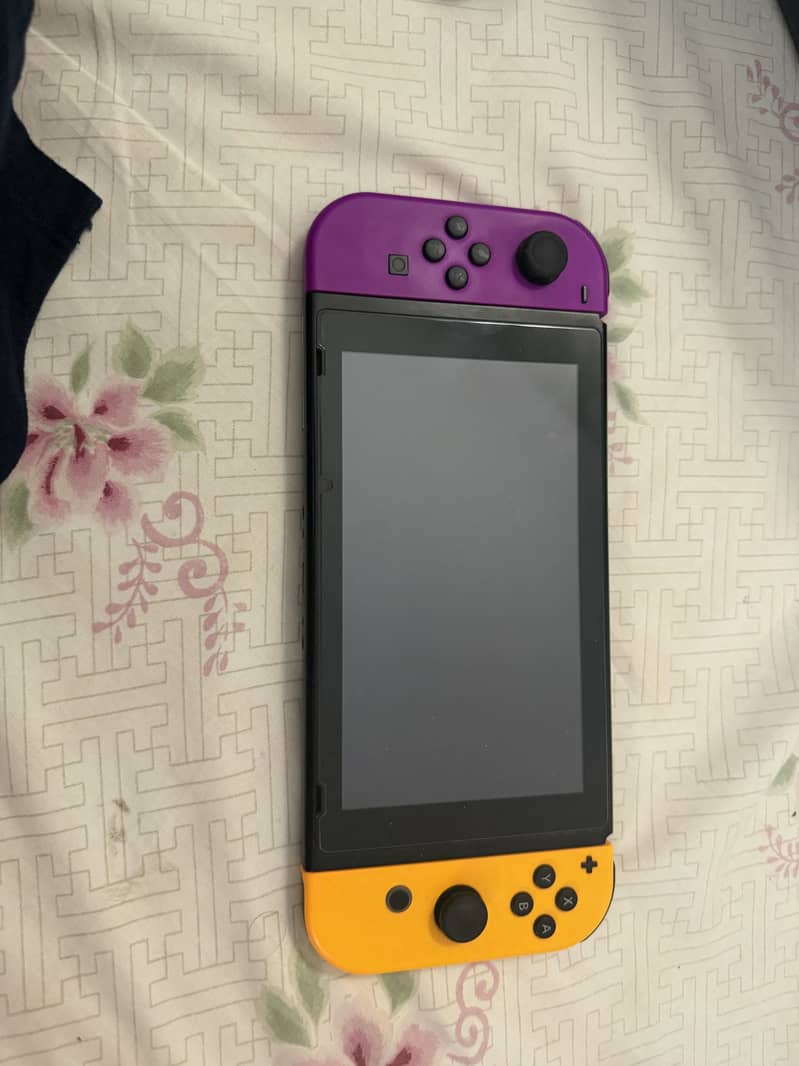 Nintendo switch 1 with two additional controllers 2