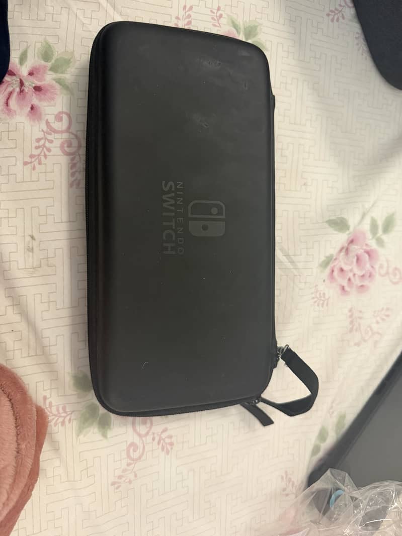 Nintendo switch 1 with two additional controllers 5