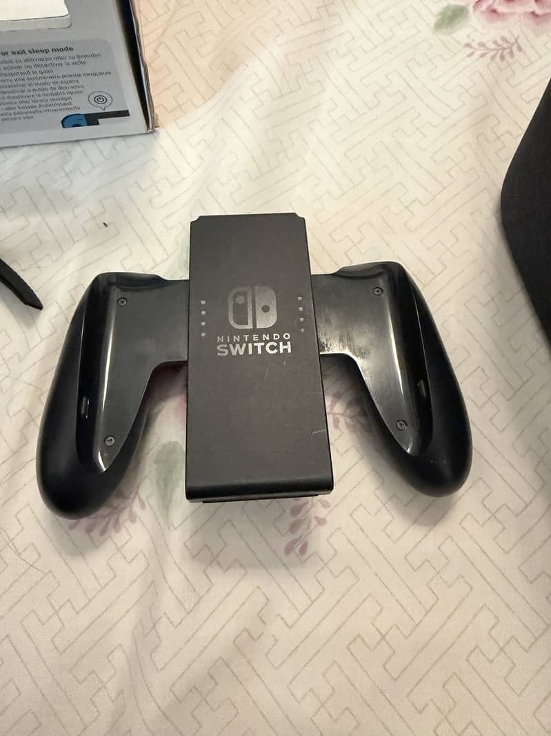 Nintendo switch 1 with two additional controllers 6