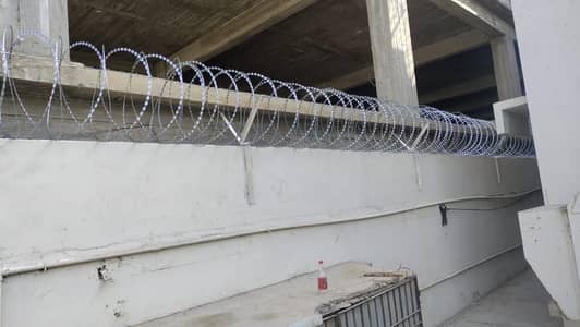 Razor wire and barbed wire
