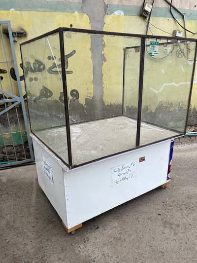 wooden counter with glass frame