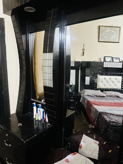 King size bed and dressing table.