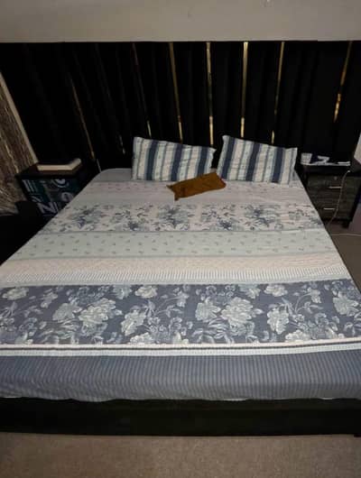 king size poshish bed with side tables, dressing table, room chairs