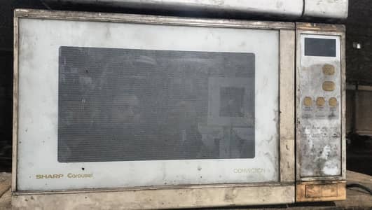 2 full size microwaves old for sale