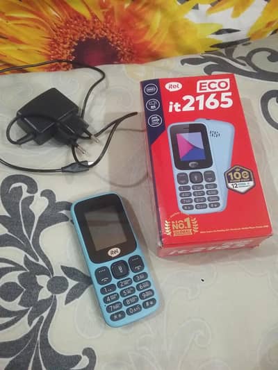 Itel it 2165 with box and charger