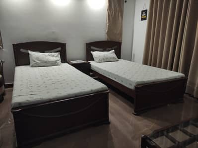 wooden single beds with mattresses
