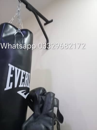 Wall mounted punching bag with accessories including chain