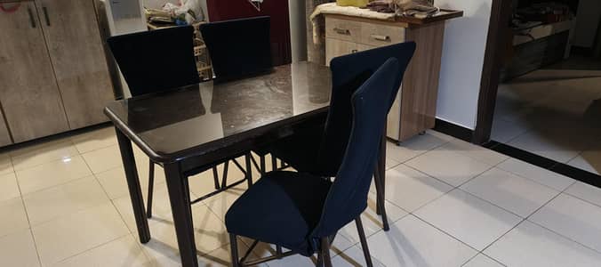 4 seat wooden dinning table with 4 iron rod chairs