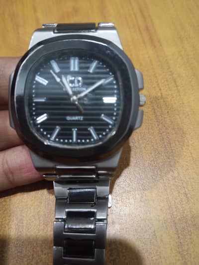 Its silver steel construction and black dial offer a modern watch