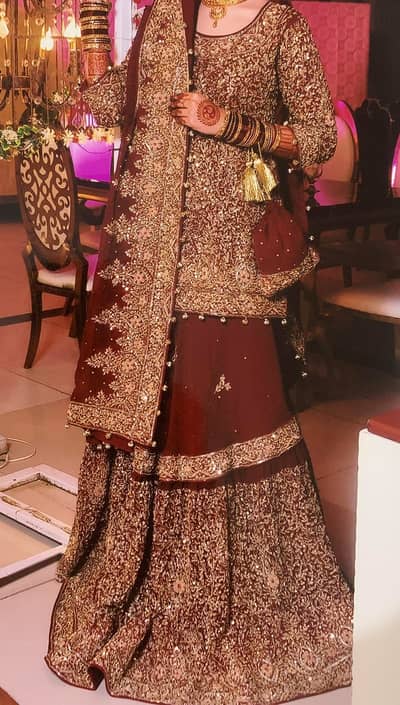 Maroon coloured bridal dress