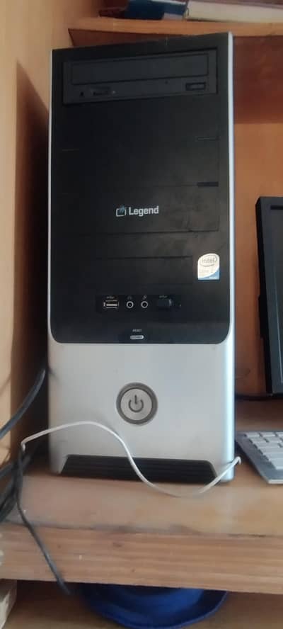 pc with one ram and motherboard and a monitor with cherry keyboard